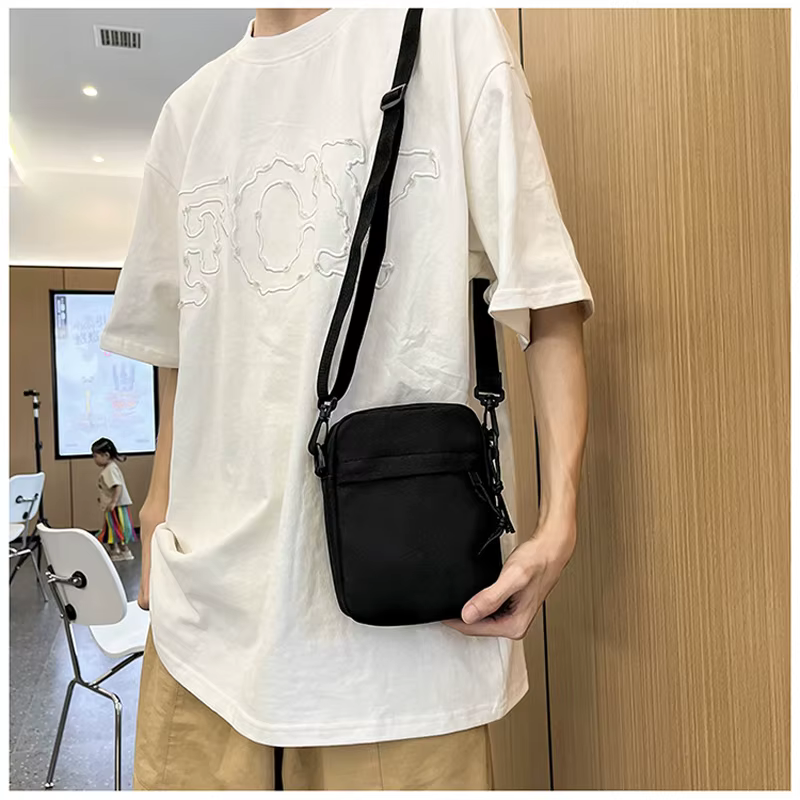 Petit sac à bandoulière pour hommes et femmes, sac à bandoulière décontracté léger avec plusieurs poches zippées pour les voyages, le travail et l'usage quotidien
