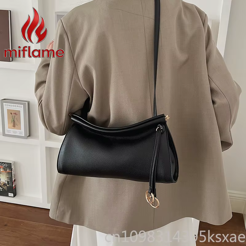 Sac à bandoulière en cuir vintage avec silhouette structurée, élégant et léger, idéal pour le travail, les trajets quotidiens