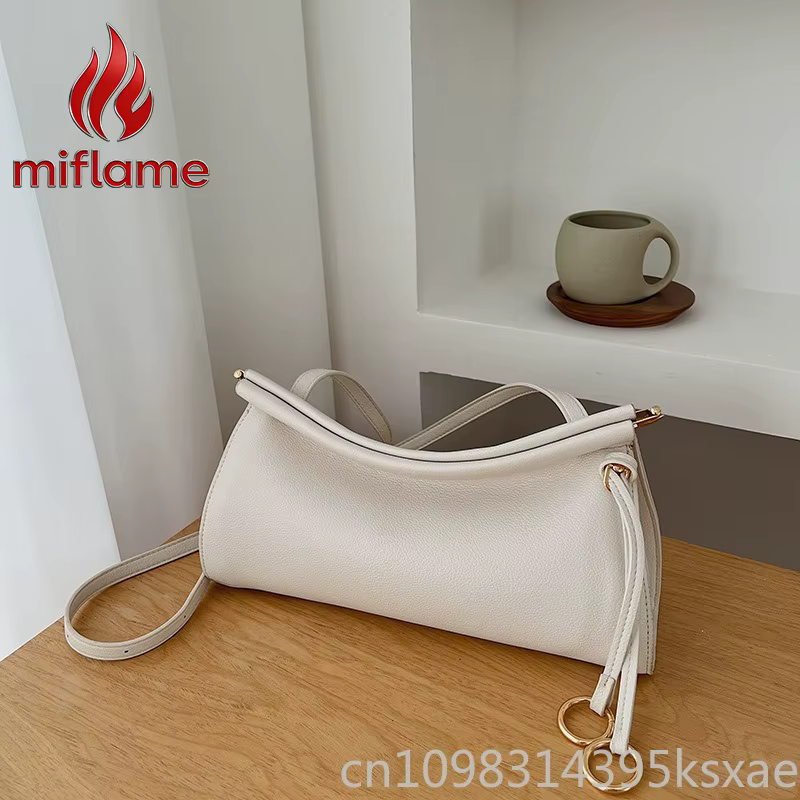 Sac à bandoulière en cuir vintage avec silhouette structurée, élégant et léger, idéal pour le travail, les trajets quotidiens