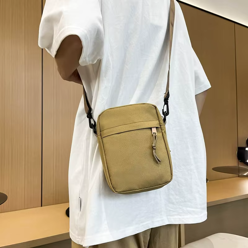 Petit sac à bandoulière pour hommes et femmes, sac à bandoulière décontracté léger avec plusieurs poches zippées pour les voyages, le travail et l'usage quotidien