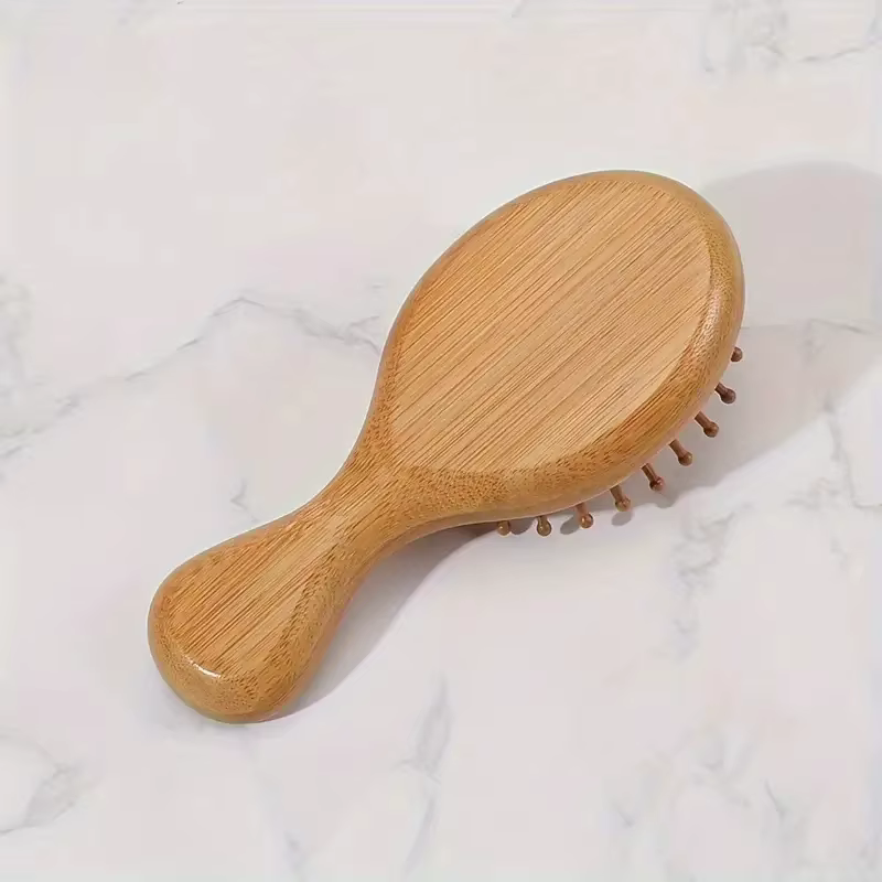 Peigne à coussin d'air en bois de bambou avec poils de Massage