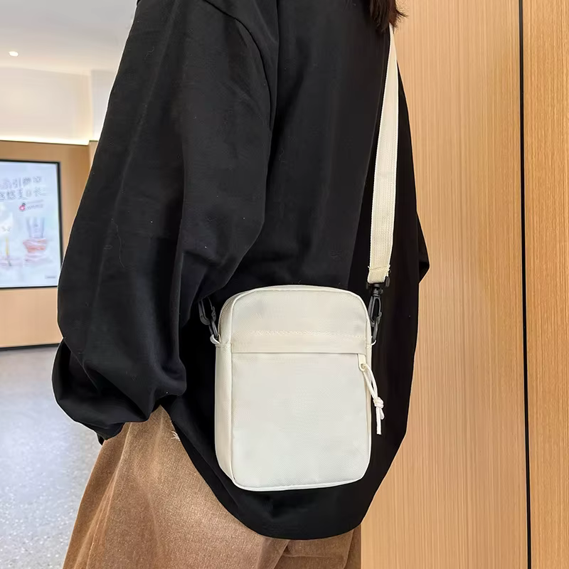 Petit sac à bandoulière pour hommes et femmes, sac à bandoulière décontracté léger avec plusieurs poches zippées pour les voyages, le travail et l'usage quotidien