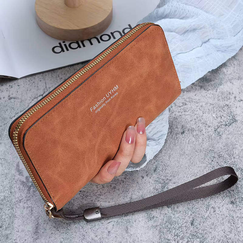 Dames tenant un long portefeuille 2025 nouveau sac à main coréen multi-fonction sac de carte sac de téléphone portable porte-monnaie femme portefeuille