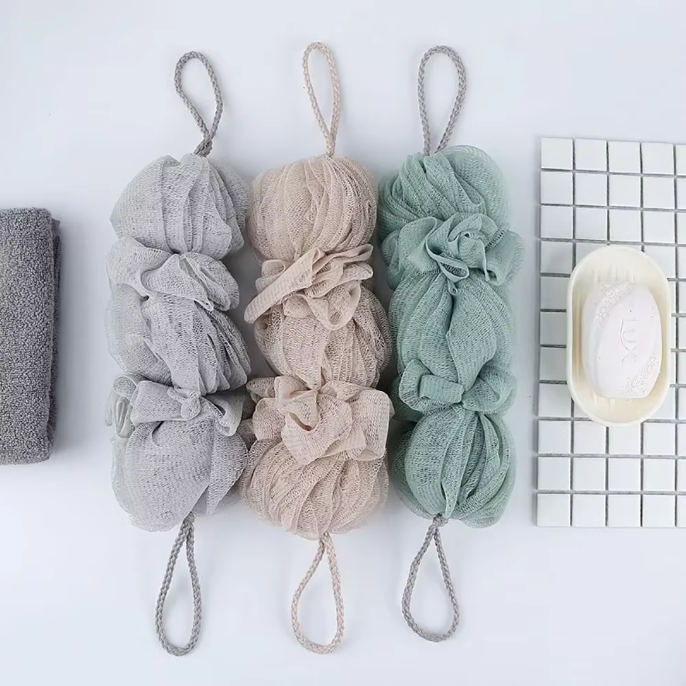 Brosse exfoliante en maille pour le corps