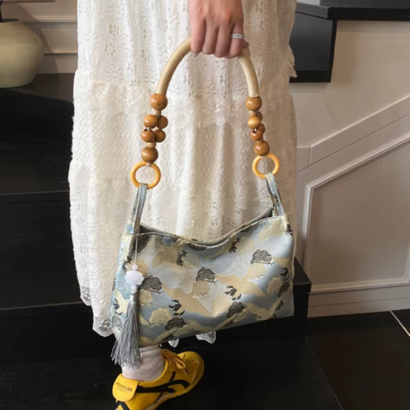 Sacs à bandoulière pour femmes, nouvelle collection printemps 2026, style ethnique brodé, avec pompons et fermoir, détails de couture, meilleures ventes