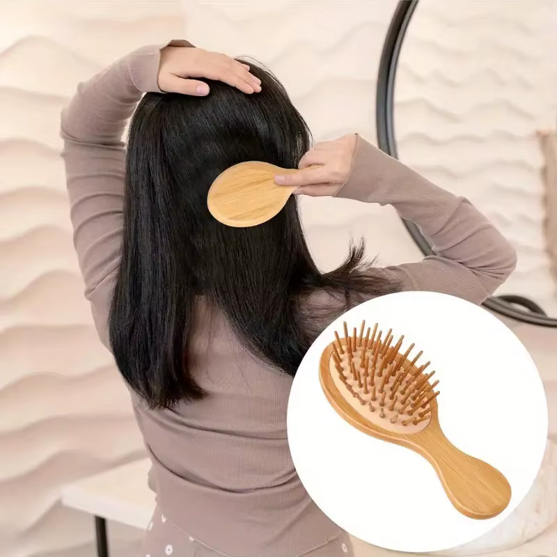 Peigne à coussin d'air en bois de bambou avec poils de Massage