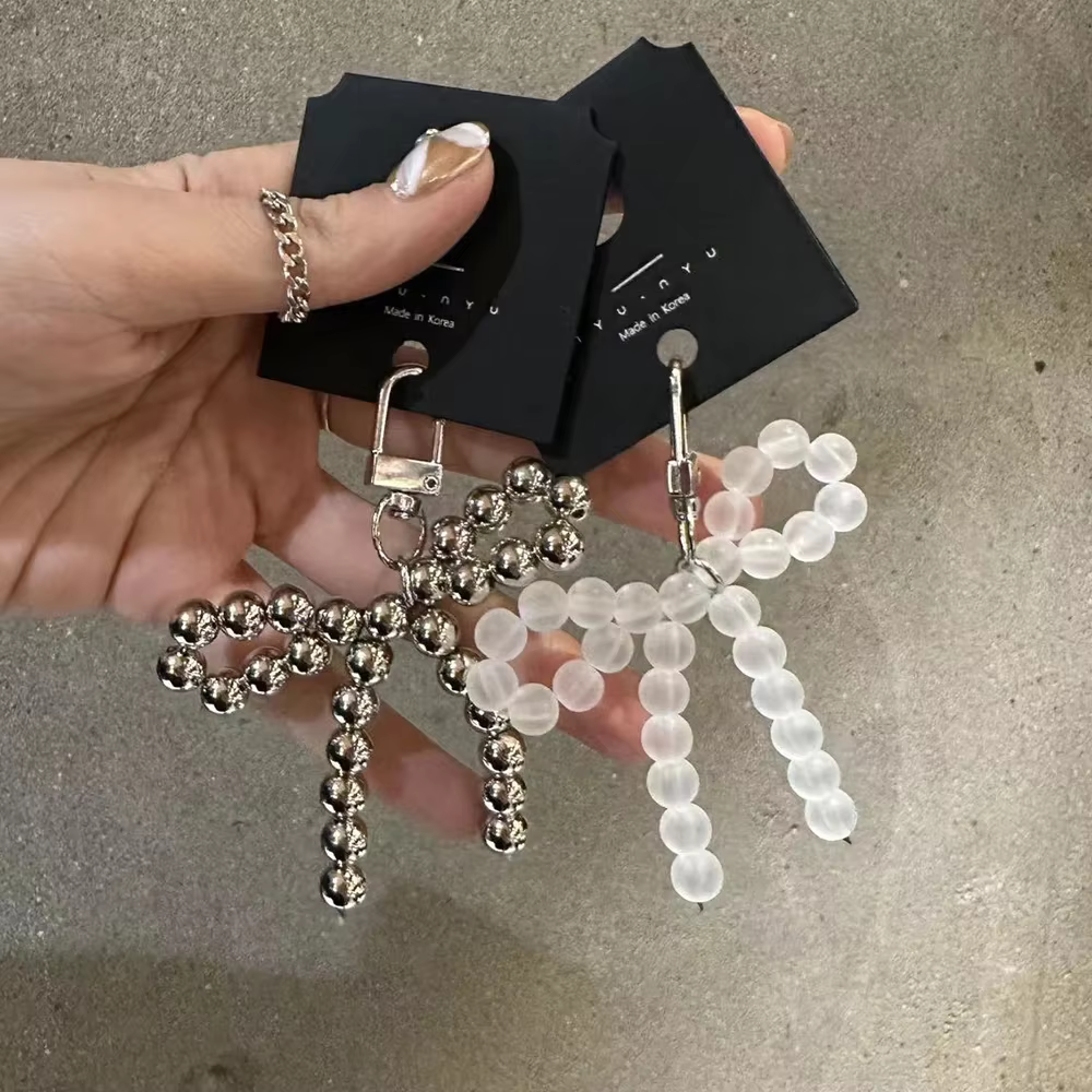 Porte-clés de perles de décoration de sac fait à la main, pendentif nœud papillon, tentures de sac délicates, porte-clés du matin, accessoires de décoration de charme, bijoux