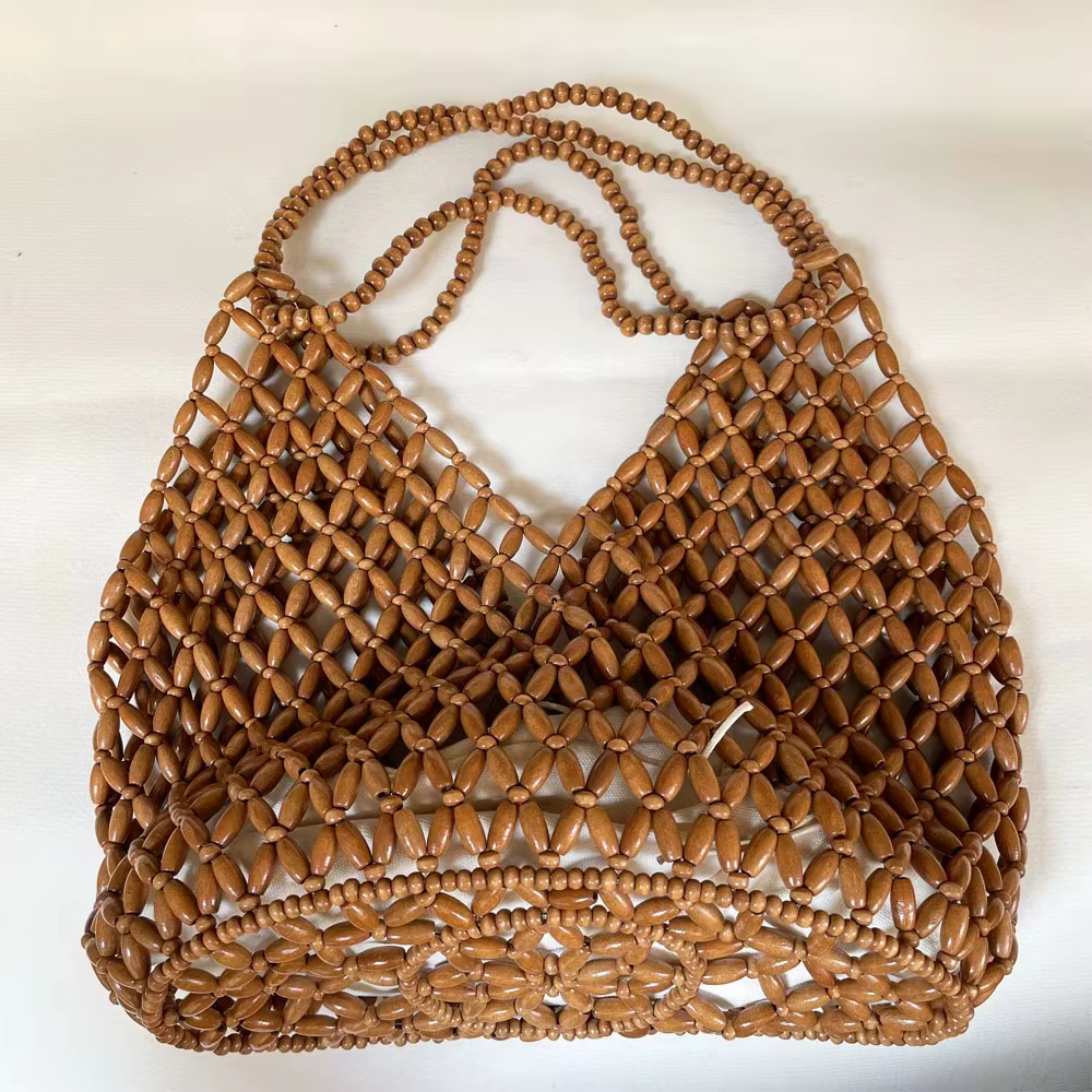 Sac à main tissé à la main avec perles pour femmes, sac à bandoulière exquis en perles de bois ajourées, sac de plage féminin