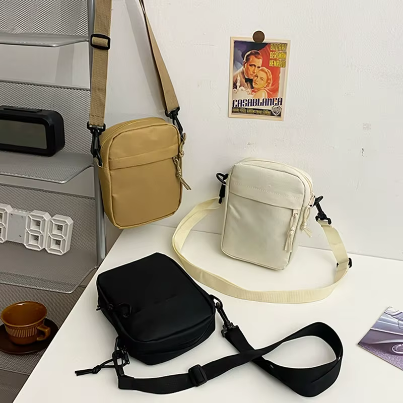 Petit sac à bandoulière pour hommes et femmes, sac à bandoulière décontracté léger avec plusieurs poches zippées pour les voyages, le travail et l'usage quotidien